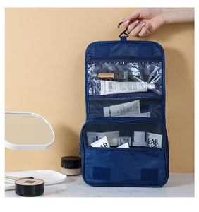 Blue hanging travel toiletry bag with multiple compartments and hook for organization