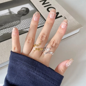 Detail of minimalist irregular branch-shaped 925 silver ring on model finger