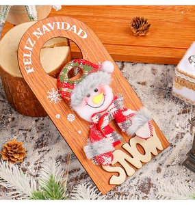 Detailed close-up of a wooden snowman Christmas door hanger featuring Feliz Navidad text