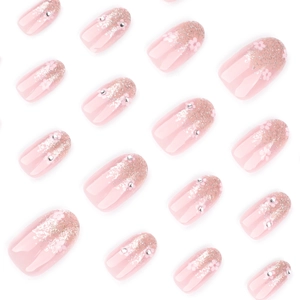 Pink gradient glitter press-on nails set with small flower patterns and rhinestones