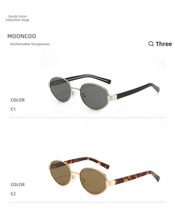 Detail view of retro oval sunglasses in black-gold and tortoise shell metal frames