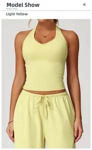 Detail of light yellow V-neck yoga tank top and high-waist drawstring shorts on model