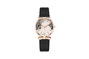 Macro detail of Tadi women's watch featuring tropical leaf dial and rose gold case