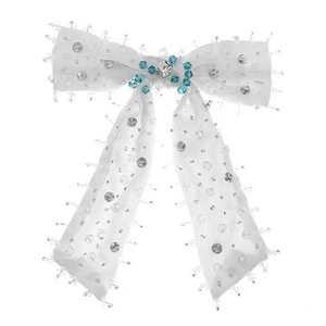 Detailed shot of white satin bow hair claw with blue gemstones and clear rhinestones