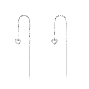 Macro detail of S925 sterling silver tassel chain earrings with hollow heart pendants