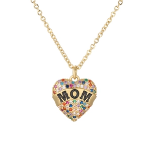 Close-up of gold heart pendant with colorful crystals and MOM engraving on necklace
