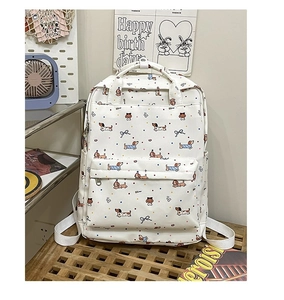 Detail of white backpack with dachshund dog pattern and colorful polka dots on a wooden shelf