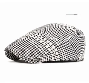 Detail of the vintage plaid beret hat in beige featuring a classic check pattern