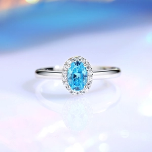 Elegant S925 sterling silver ring with oval aquamarine zircon and halo diamond design
