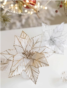 Detail of velvet mesh Christmas flowers with glitter edges and golden berry center