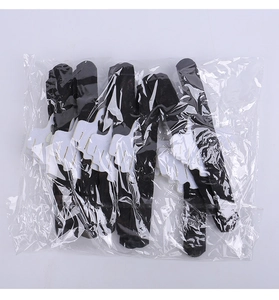 Close-up of Halloween bat hair clips in clear packaging with white flocking details