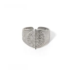 Detailed close-up of Saint Benedict Medal ring in silver stainless steel with Jesus text