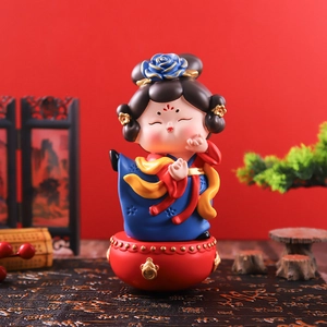 Ancient style girl tumbler ornament in blue and red dress on a drum base