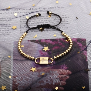 Adjustable black rope bracelet with gold copper beads and a zircon cross square pendant