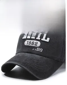 Detail of vintage washed denim cap with 3D embroidery showing textured fabric and brim