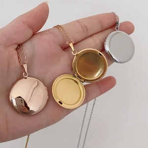 Locket necklace in gold, rose gold and silver finish shown in open and closed positions