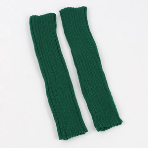 Detail of dark green knit arm warmers showing the thick vertical rib knit texture