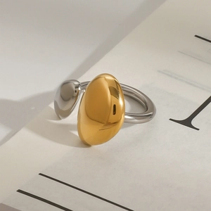 Minimalist asymmetrical two-tone ring in polished gold and silver stainless steel
