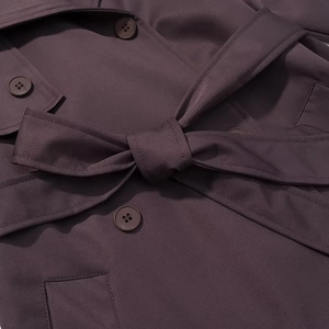 Women fashion deep purple long trench coat featuring belted waist and double-breasted buttons
