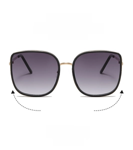 Front view of oversized black and gold sunglasses with purple gradient lenses