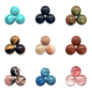 Detailed arrangement of sorted round natural crystal gemstone beads in various colors