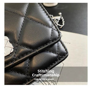 Close-up of diamond-quilted leather texture and precision stitching on a black crossbody bag