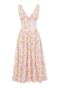 Detailed macro view of pink floral print fabric texture on a V-neck summer dress