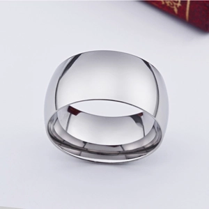 Macro shot of wide mirror polished silver stainless steel ring with smooth surface