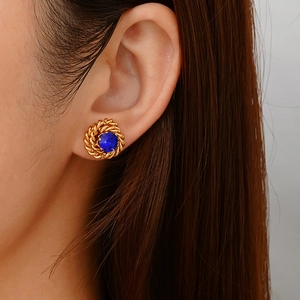Vintage 18K gold plated stainless steel rose stud earrings with dark blue zircon on ear