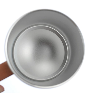 Close-up of the smooth brushed metal interior texture of a stainless steel tumbler