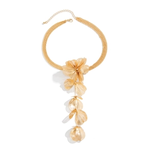 Detailed view of the golden floral pendant with brushed texture and multi-strand chain