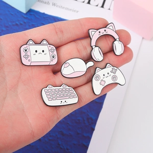 5-piece pink gaming enamel pin set featuring cute console, keyboard, and headset icons