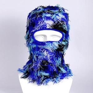 Distressed knitted balaclava mask with fringe and tassel details in blue and white