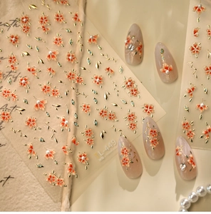 Detail of TL-449 nail stickers with 3D floral petals, gold leaves and pearls on nails
