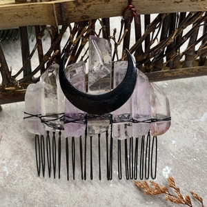 Macro detail of natural amethyst crystals and black moon on handmade bridal hair comb