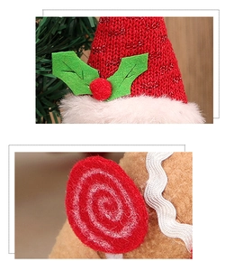 Detailed view of knitted Christmas hat and felt bird decor with scalloped trim