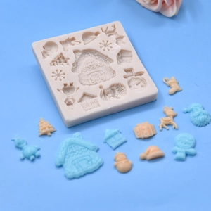 Beige Christmas silicone mold for DIY baking with gingerbread house and reindeer shapes
