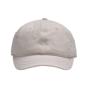 Detail of short brim baseball cap in beige cotton twill with reinforced stitching