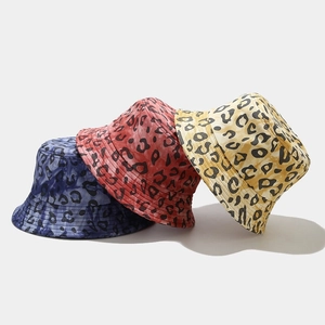 Women's cotton leopard print bucket hats in blue, red, and yellow for sun protection