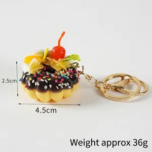 Faux chocolate donut keychain with red cherry and colorful sprinkles, 4.5cm diameter size