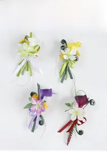 Detail view of multi-color PU calla lily boutonnieres with silk ribbons and pearls