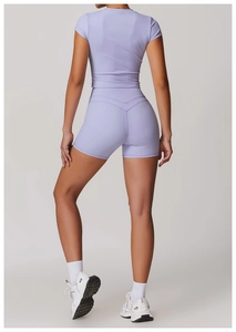 Detail view of V-shaped back seam on high-waist lavender yoga shorts for butt-lifting effect