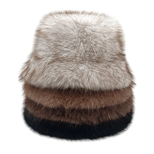 Vertical stack of fluffy faux fur bucket hats in grey, brown, and black colors