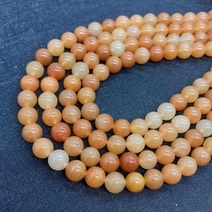 Macro shot of natural orange aventurine stone beads for DIY jewelry making