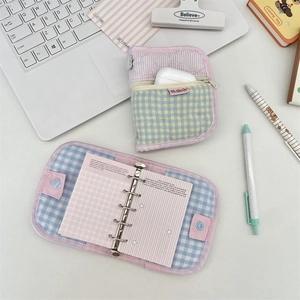 Detailed view of quilted cotton binder and matching zipper pouch in macaroon colors
