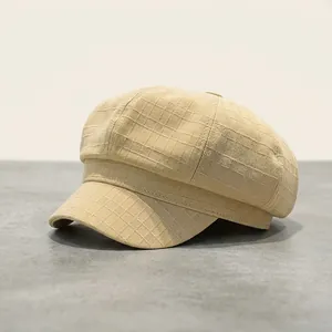 Striped newsboy cap with 8cm height and 5cm brim shown from a detailed front side angle