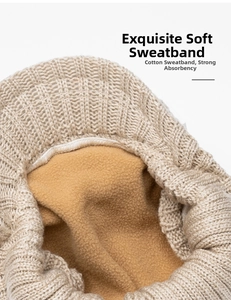 Close-up of soft cotton sweatband and thermal fleece lining in knitted winter hat