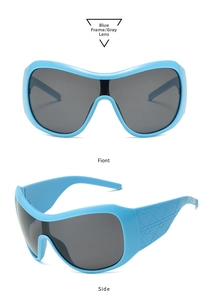 Detail of blue oversized Y2K mask sunglasses featuring 3D geometric embossed temples