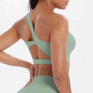 Detail of the asymmetric back straps on this sage green yoga bra and high waist leggings