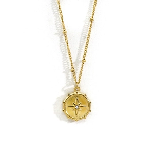 Detail of 14K gold plated North Star pendant necklace with sparkling zircon stone